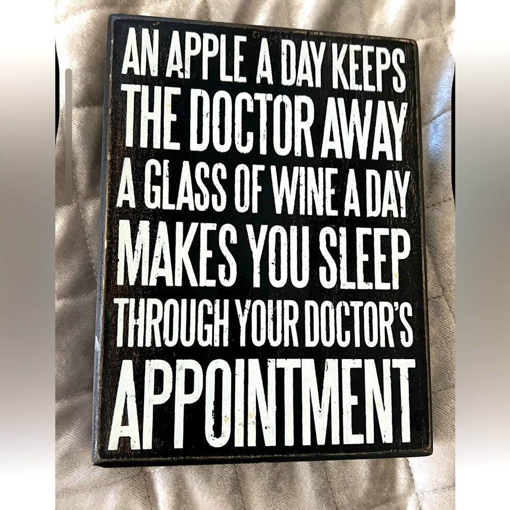 Funny black and white wood sign with a doctor joke